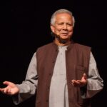 Portrait of Nobel Peace Prize laureate Professor Muhammad Yunus smiling at an official event.